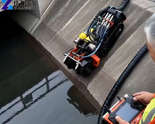 crawler robot removing accumulated sludge from a wastewater treatment tank